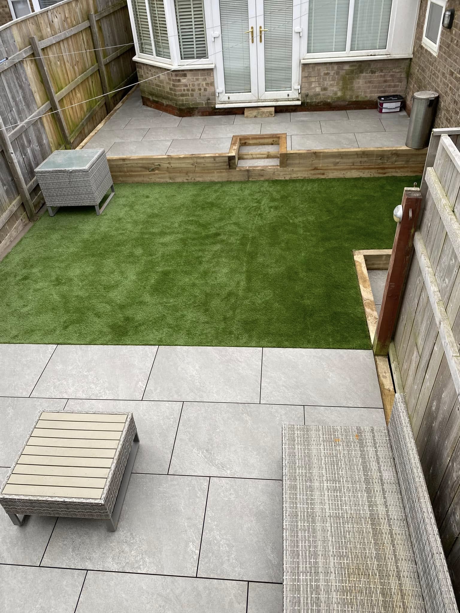Paved patio area with planting borders